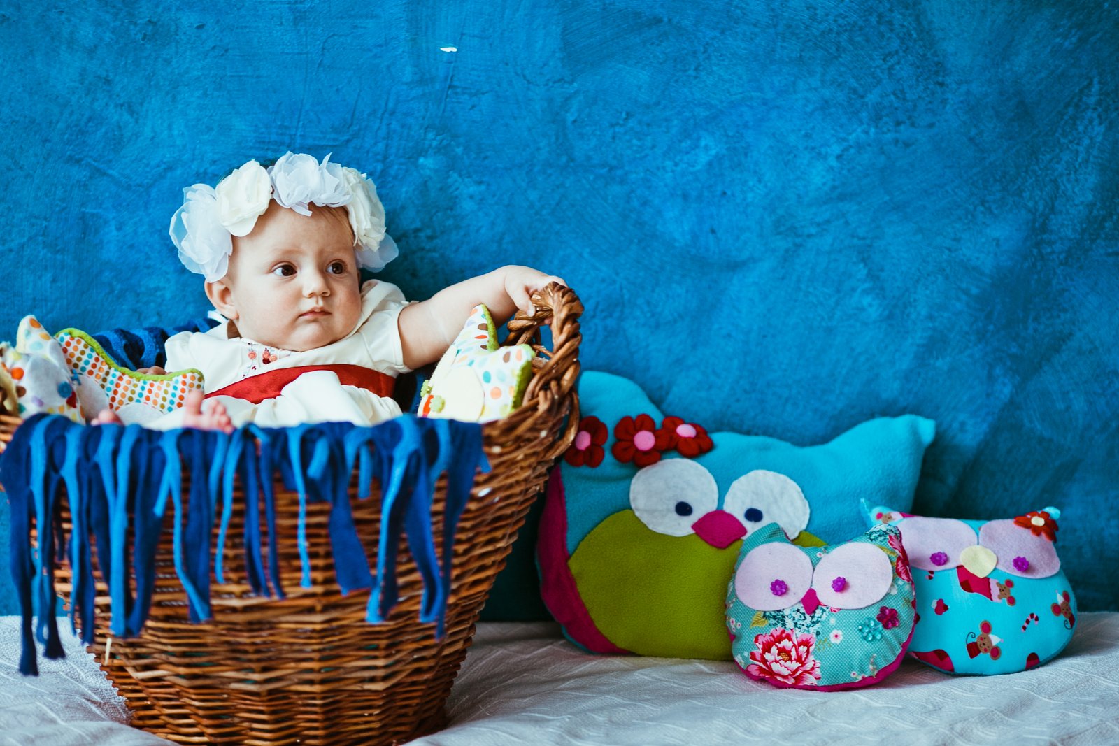 toddler-girl-lying-baby-bassinet